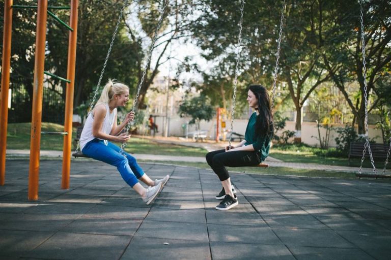 Two girls on swings