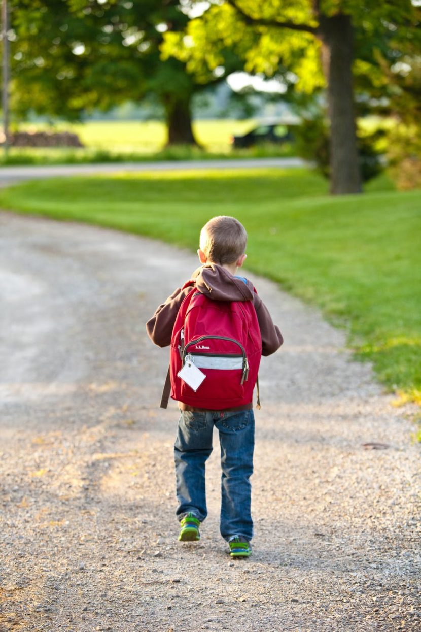 Boy walking to kindergarten