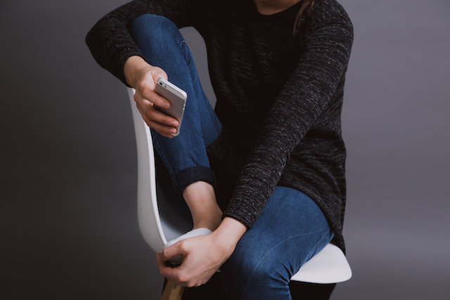 Reading device propped on knee